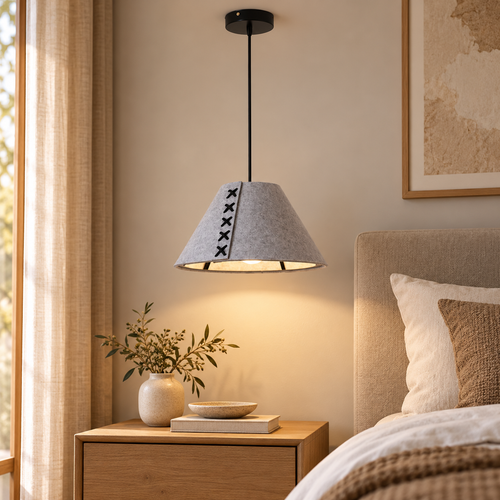 Grey felt cone pendant with stitched seam above a bedside table