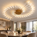 Gold spiral LED ceiling chandelier installed above a contemporary dining table