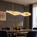 French-gold crystal LED pendant installed above a refined dining table