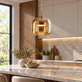 Amber glass shade LED pendant installed above a contemporary kitchen island