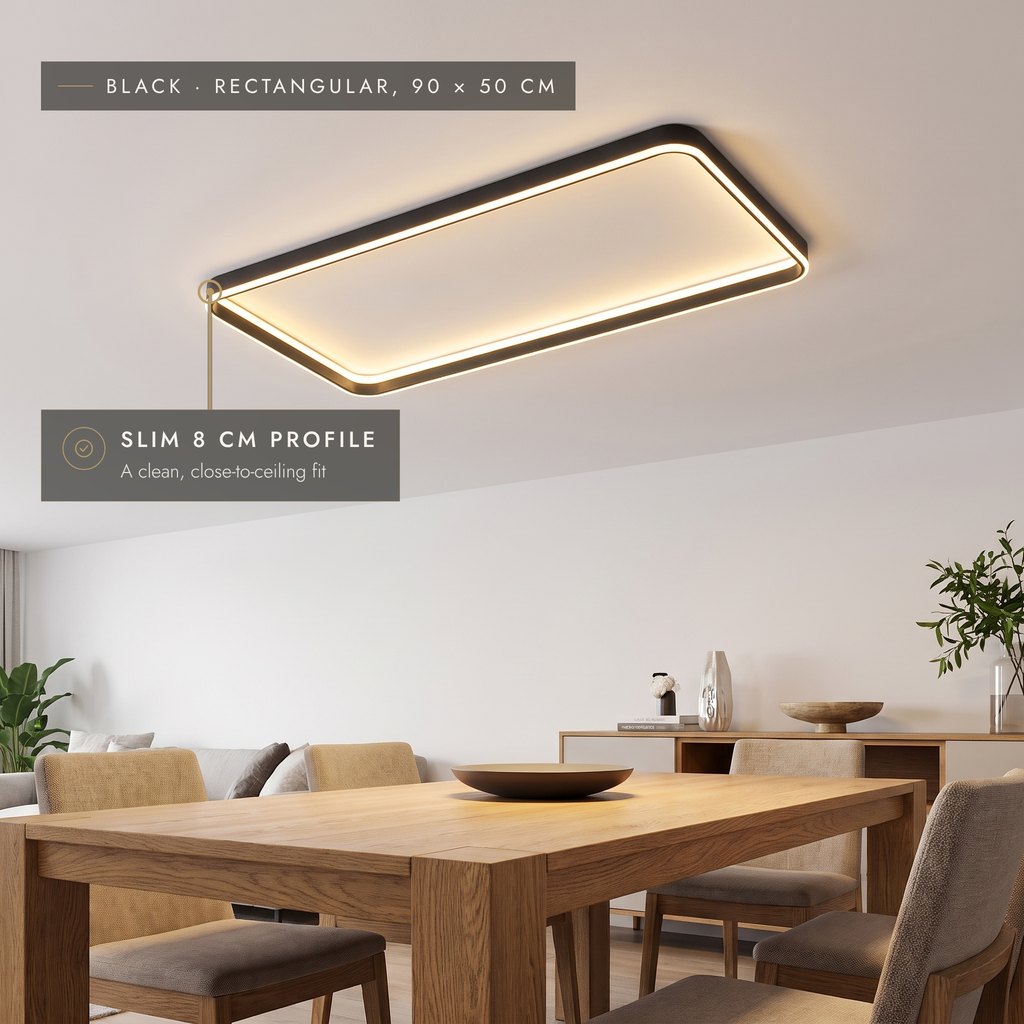 Black rectangular LED halo ceiling light, 90 × 50 cm, above a dining table