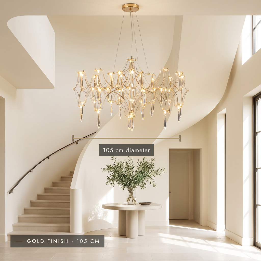 Gold finish 105 cm crystal-effect LED chandelier in a double-height entrance hall