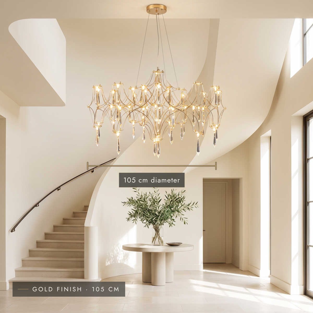 Gold finish 105 cm crystal-effect LED chandelier in a double-height entrance hall
