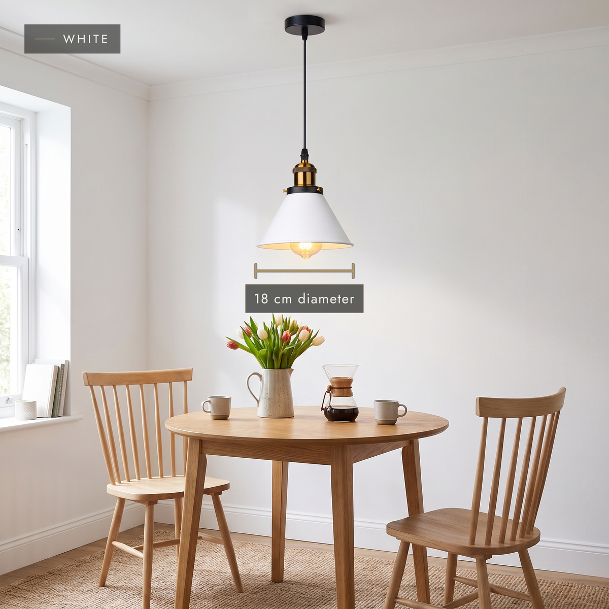 White cone pendant light above a small round oak dining table