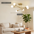 Gold semi-flush Sputnik ceiling light, 70 cm across, in a living room