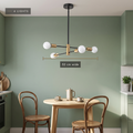 Four-light Sputnik chandelier, 52 cm wide, above a small dining table