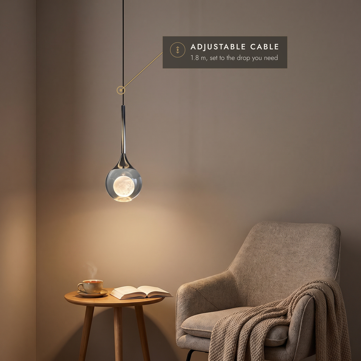 Teardrop pendant light on an adjustable 1.8 m cable above a reading chair