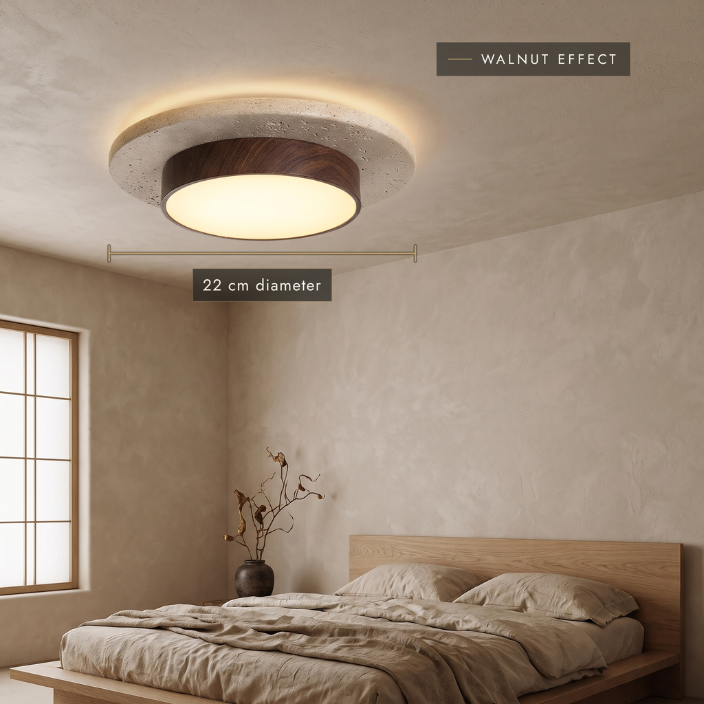 Walnut-effect travertine LED ceiling light, 22 cm, in a bedroom
