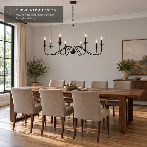 Black eight-light curved-arm chandelier above a walnut dining table.