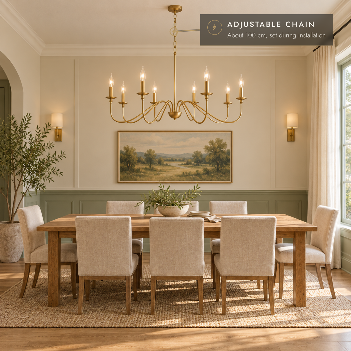 Gold eight-light curved-arm chandelier above an oak dining table in a sage and ivory room.